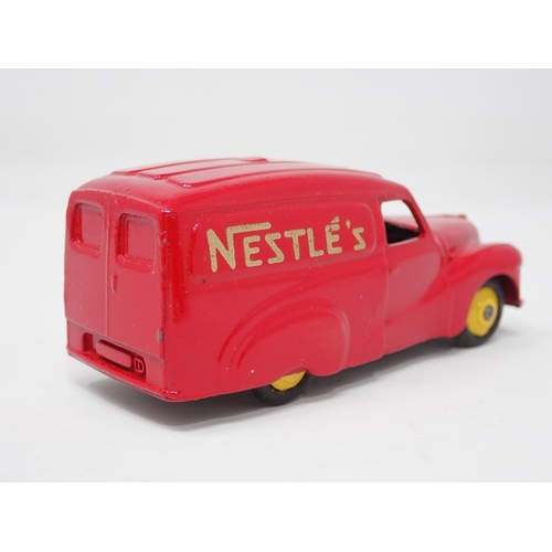 1324 - A boxed Dinky Toys No.471 Austin 'Nestle' Van