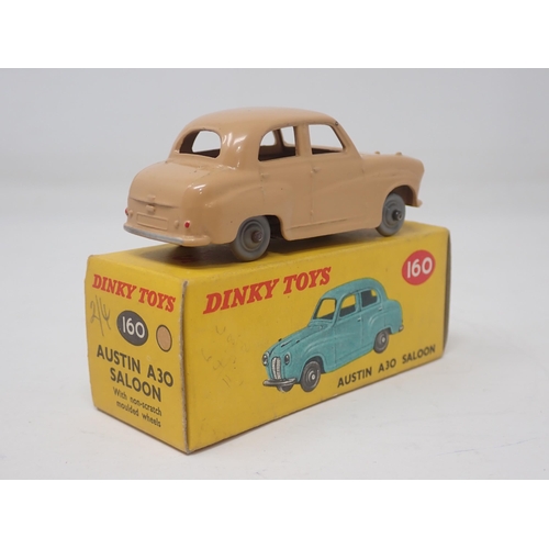 1335 - A boxed Dinky Toys No.160 tan Austin A30 Saloon