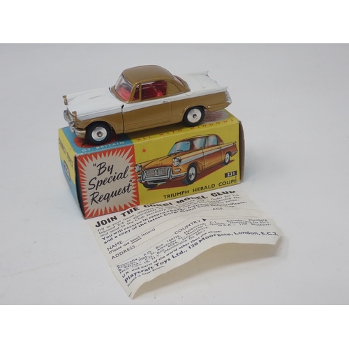 1351 - A boxed Corgi Toys No.231 gold and white Triumph Herald Coupe