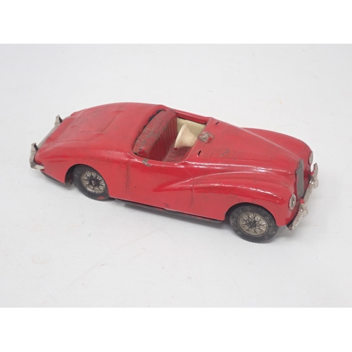 1481 - A boxed Japanese tinplate friction Jaguar Coupe and an unboxed Startex Sunbeam Alpine A/F