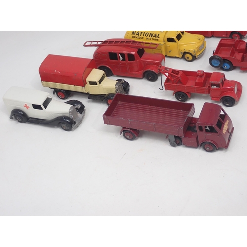 1488 - Eight unboxed Dinky Toys including National Benzole Tanker, Esso Tanker, Jeep, etc., some repainted