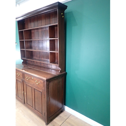 79 - A 19th Century oak Dresser and Rack the base fitted two frieze drawers above pair of fielded panel d... 