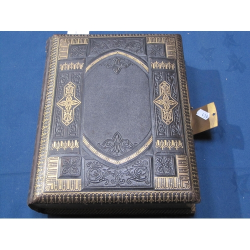 407 - A late 19th Century family Photo Album incorporating a Music Box, the album bound in padded leather ... 