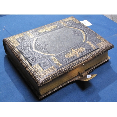 407 - A late 19th Century family Photo Album incorporating a Music Box, the album bound in padded leather ... 