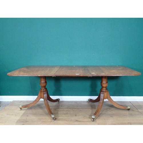 562 - A reproduction mahogany veneered twin pedestal Dining Table with spare leaf 6ft 4in L x 2ft 5in H