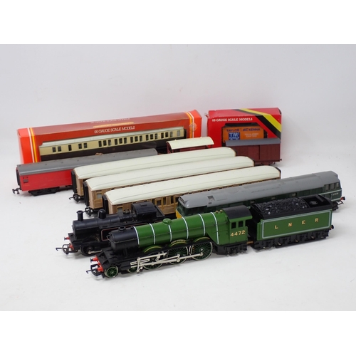 1650 - An unboxed Hornby 00 gauge 'Flying Scotsman', three LNER teak Coaches, Triang Diesel Locomotive, 0-6... 