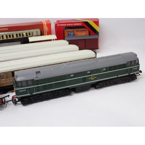 1650 - An unboxed Hornby 00 gauge 'Flying Scotsman', three LNER teak Coaches, Triang Diesel Locomotive, 0-6... 