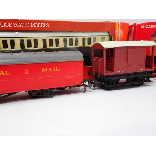 1650 - An unboxed Hornby 00 gauge 'Flying Scotsman', three LNER teak Coaches, Triang Diesel Locomotive, 0-6... 