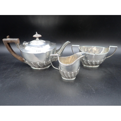 115 - An Edward VII silver three piece Tea Service of oval semi-fluted form, London 1901, 620gms all in