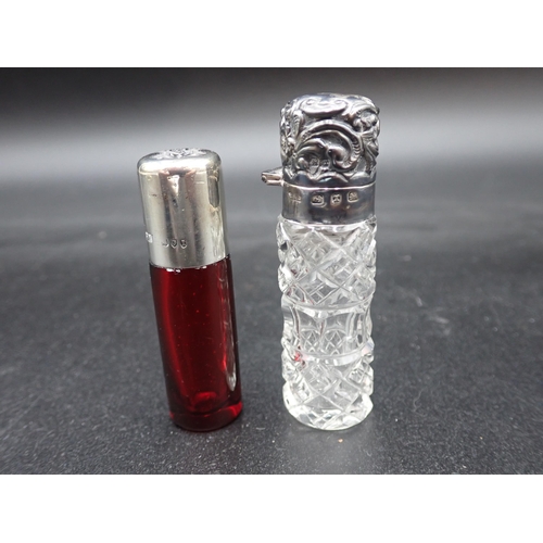 120 - A Victorian silver lidded cut glass Scent Bottle, Birmingham 1897, and a silver lidded ruby glass Sc... 