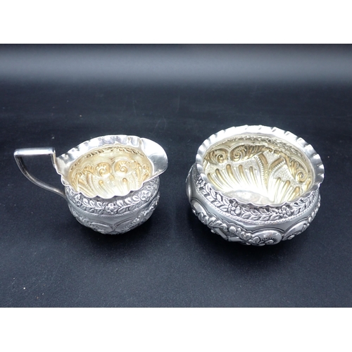 125 - A Victorian silver Sugar Bowl and Milk Jug with leafage scroll and gadroon embossing, London 1891/2