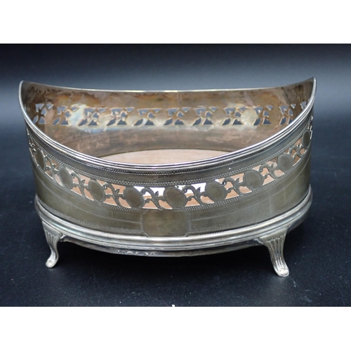 135 - A George III silver oval Cruet Stand with pierced frieze, later wooden base on splay feet, London 17... 