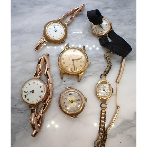 158 - Two lady's Wristwatches in 9ct gold cases, another marked 14ct and three other watches
