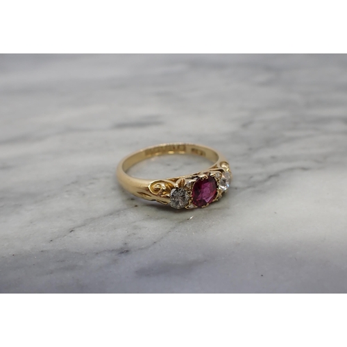 160 - A Victorian Ruby and Diamond three stone Ring set oval-cut ruby between two old-cut diamonds in 18ct... 