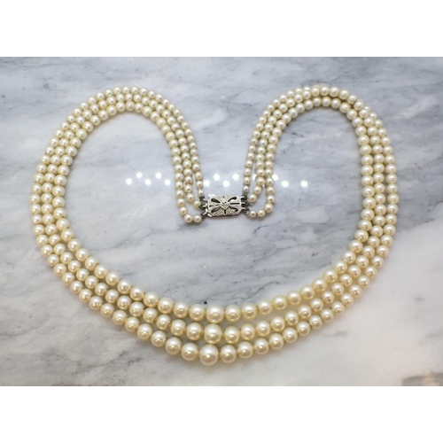 164 - A triple row of graduated Cultured Pearls on openwork 9ct white gold clasp set rose-cut diamond