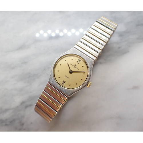 165 - A lady's Baume and Mercier quartz Wristwatch the circular gold coloured dial with roman numerals at ... 