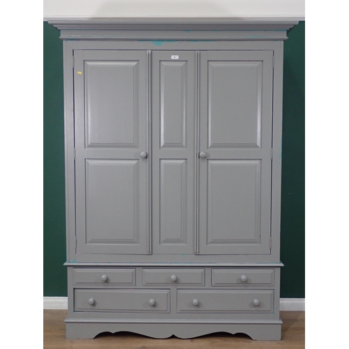 20 - A modern painted pine Wardrobe, the top section with pair of panelled doors, above the base fitted t... 