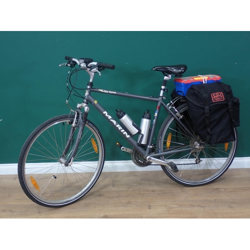 23 - A Marin San Rafael Bicycle with pair of bike panniers and a tool box containing quantity of spares, ... 