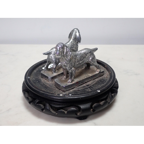 297 - A pair of chrome plated Spaniel Car Mascots, 3in L x 2 1/4in H, mounted on a wooden stand