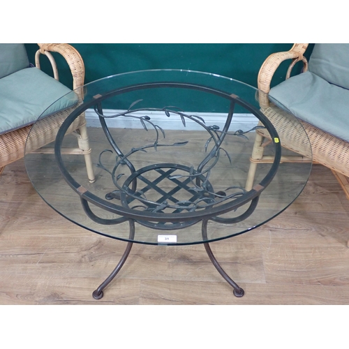 31 - A metal framed Conservatory Table with leafage designs with circular glass top, 35.5