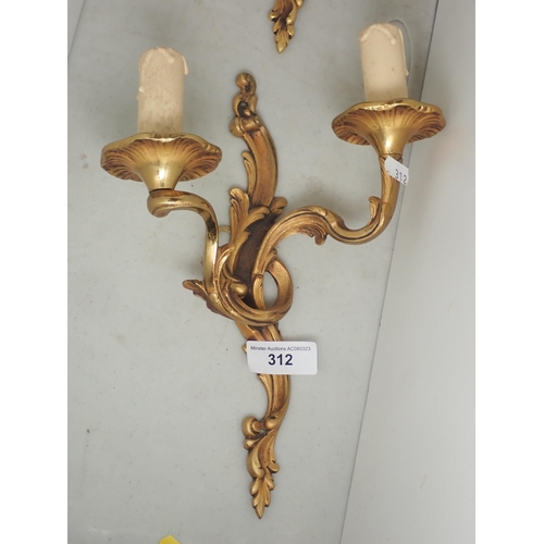 312 - A pair of gilt metal two branch Wall Lights with scrolled foliate designs, 12in H