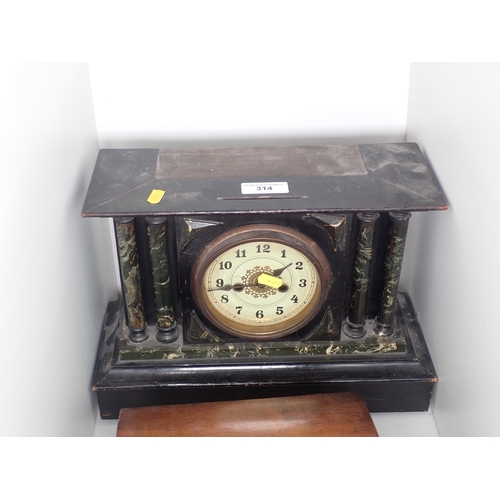 314 - A black and variegated Mantel Clock, a domed walnut 