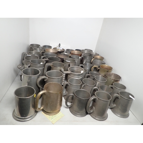 315 - A large quantity of pewter Tankards