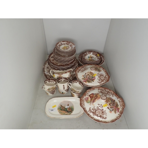 328 - A Royal Worcester part Dinner Service 'Game Series' and a pair of Falconware Dishes