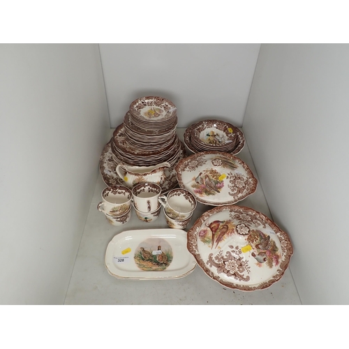 328 - A Royal Worcester part Dinner Service 'Game Series' and a pair of Falconware Dishes