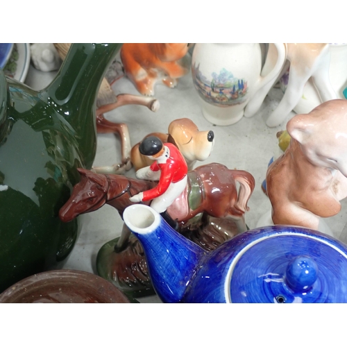 357 - A quantity of Figurines including birds, children, also Teapots, etc