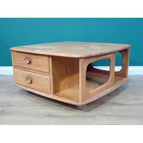 38 - An Ercol Pandora's Box Coffee Table with two fitted drawers, on castors (Labelled in top Drawer), A/... 