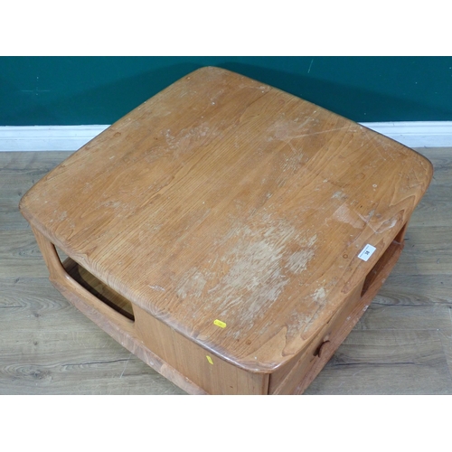 38 - An Ercol Pandora's Box Coffee Table with two fitted drawers, on castors (Labelled in top Drawer), A/... 