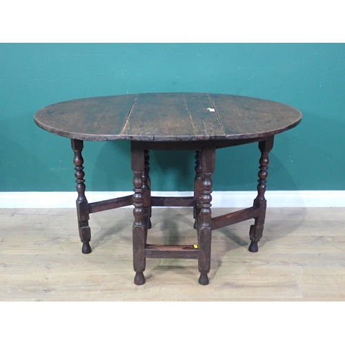 39 - An antique oak Gateleg Table on turned supports, A/F, 2ft 5