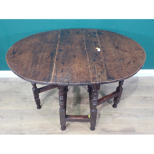 39 - An antique oak Gateleg Table on turned supports, A/F, 2ft 5