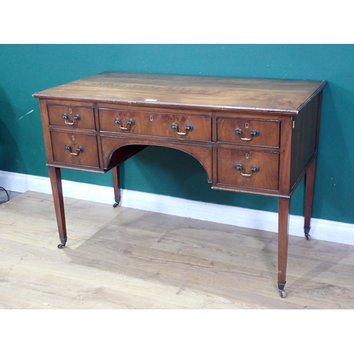 40 - A mahogany Dressing Table with five fitted drawers on square tapering supports and castors, 3ft 10