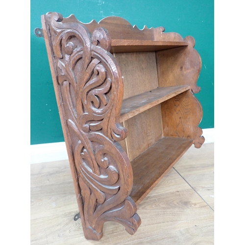 477 - A set of oak open Wall Shelves with carved ends, 2ft 2in W