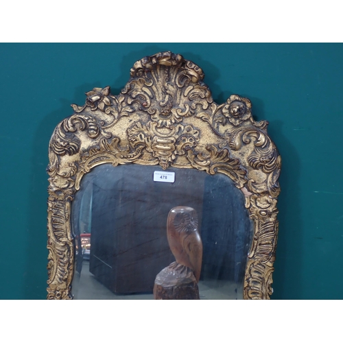 478 - An elaborate gilt framed Wall Mirror with scrolled and foliate design, 3ft 8in H x 1ft 9in W