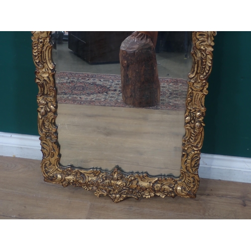 478 - An elaborate gilt framed Wall Mirror with scrolled and foliate design, 3ft 8in H x 1ft 9in W