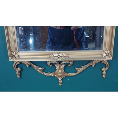 480 - A pair of gilt framed Wall Mirrors with Vase and drape surmounts and oval floral decorations.