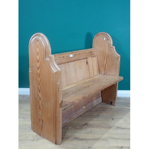 501 - A small pitch pine Pew with arched and moulded side supports, 3ft 8in W