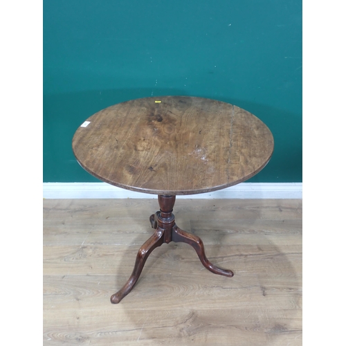 517 - A 19th Century mahogany tilt-top Table with turned column and tripod base, 2ft 5in diam