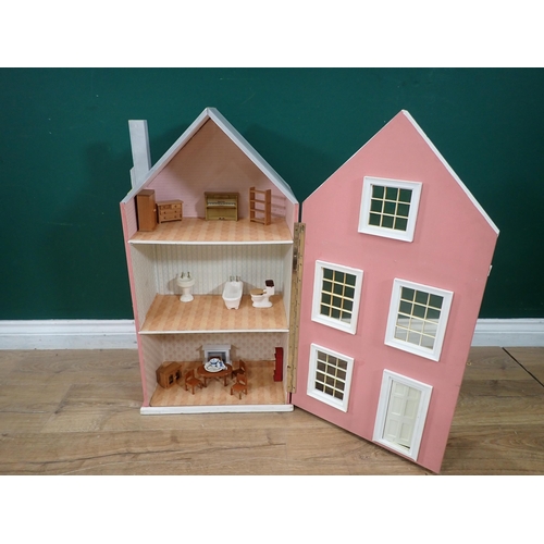 529 - A pink painted Dolls House with some Furniture, 29