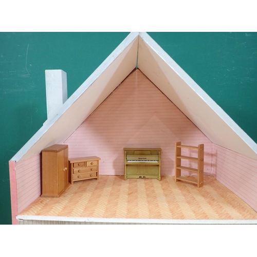 529 - A pink painted Dolls House with some Furniture, 29