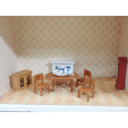 529 - A pink painted Dolls House with some Furniture, 29