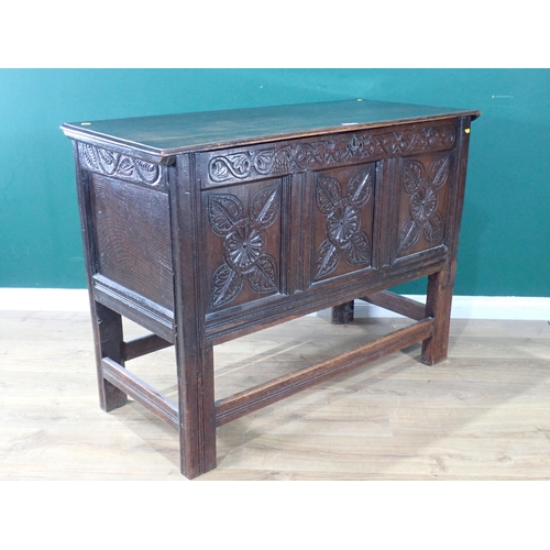 533 - An antique oak Coffer with carved three panel front, raised on later stand and stretchers, 3ft 1