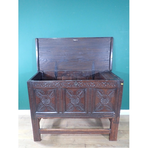 533 - An antique oak Coffer with carved three panel front, raised on later stand and stretchers, 3ft 1