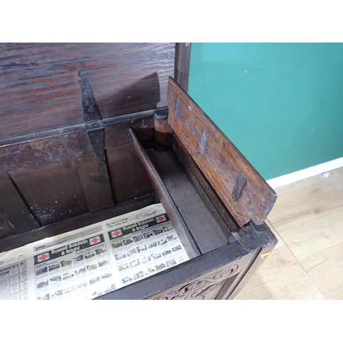 533 - An antique oak Coffer with carved three panel front, raised on later stand and stretchers, 3ft 1