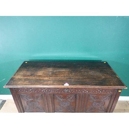 533 - An antique oak Coffer with carved three panel front, raised on later stand and stretchers, 3ft 1