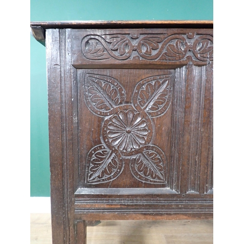 533 - An antique oak Coffer with carved three panel front, raised on later stand and stretchers, 3ft 1