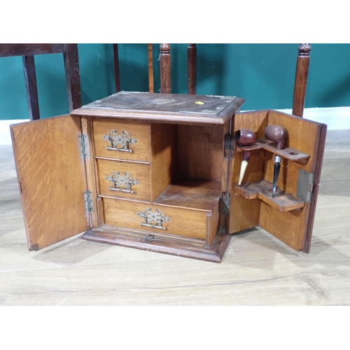 536 - A mahogany Pot Cupboard on turned tapered supports, an oak Smokers Cabinet, a folding Cake Stand and... 